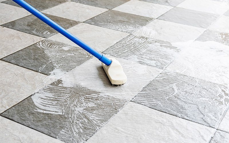 Doctor Clean actively deep cleaning soapy ceramic tile floors.